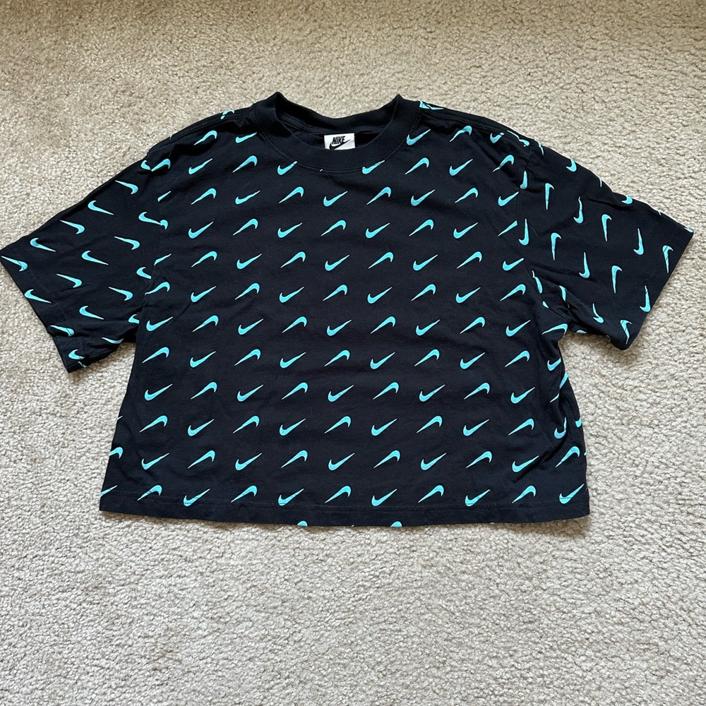 Nike Black Women’s Cropped Shirt with Teal Swoosh Design